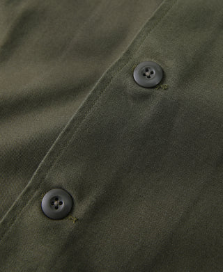 Olive fatigue utility shirt close-up of button placket and topstitching