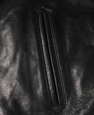Black goatskin leather jacket interior pocket opening with stitched border