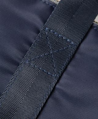 Navy stitched webbing strap panel on helmet bag
