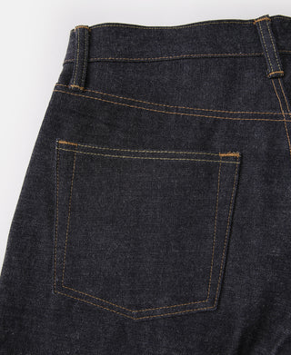 Indigo selvedge denim jeans waistband and front pocket with orange-brown topstitching