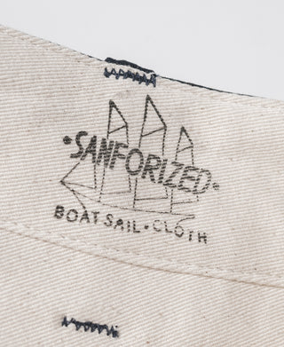 Navy fabric inner label with decorative stamp markings