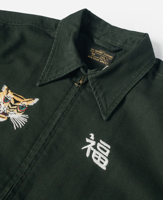 Dark green jacket chest with tiger embroidery on left and white character emblem on right