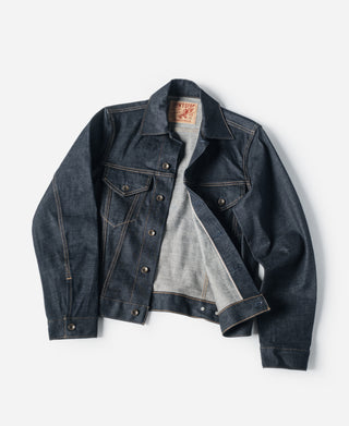 Indigo denim jacket with point collar, button front, and chest flap pockets