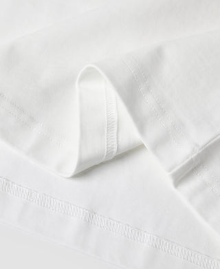 White henley t-shirt hem with stitched edge and curved fold