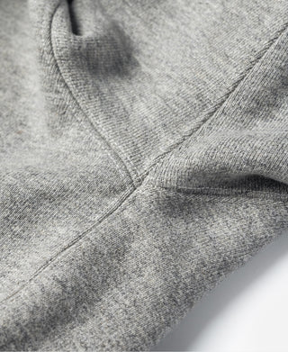 Gray fleece sweatshirt cuff and stitched seam close-up