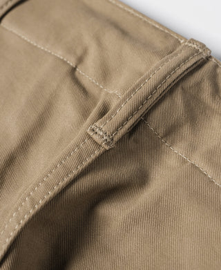 Khaki trouser fly seam with reinforced stitching