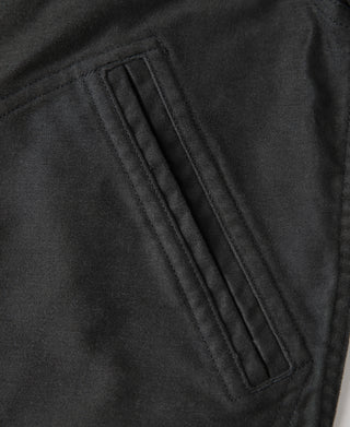 Black moleskin Cossack jacket pocket flap with stitched lines and edge stitching