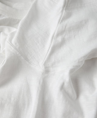 White slub cotton T-shirt front panel fabric close-up