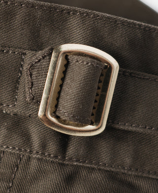 Brown combat pants waistband with metal buckle and stitched strap detail