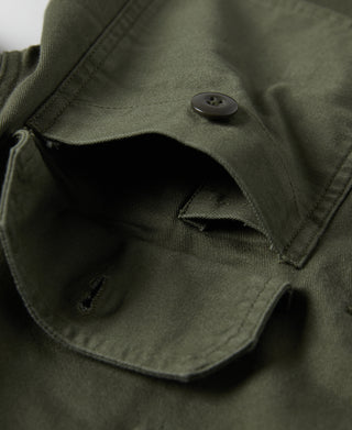 Olive fatigue utility shirt pocket opening with button and flap seam