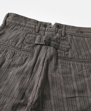 Dark gray pinstripe pants upper front with adjustable strap and number 29