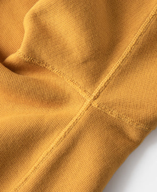 Yellow raglan sweatshirt sleeve cuff and knit rib detail