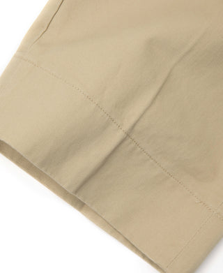 Khaki chino close-up of side seam and stitched panel under pocket area