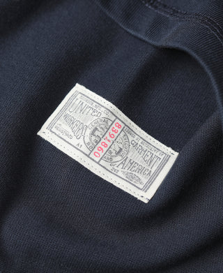 Navy henley shirt inner label with United States printed text.