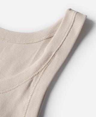 Cotton tank top armhole in light cream with stitched ribbed edge and seam