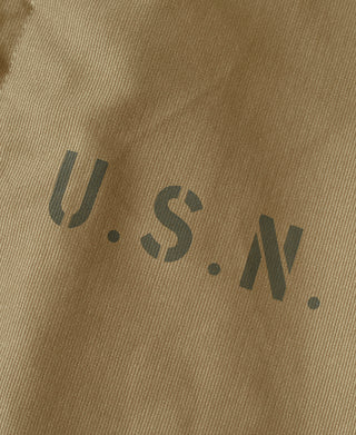 Khaki deck jacket with large U.S. Navy lettering on front