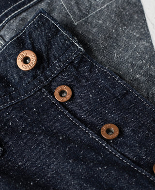 Indigo denim carpenter pants buttoned bib pocket flap with copper-tone buttons