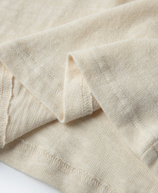 Cream T-shirt sleeve and side seam detail