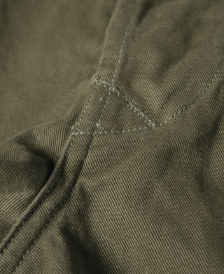 Olive Bermuda pants interior seam and stitched pleat detail