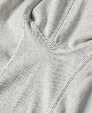 Light gray T-shirt sleeve hem and collar seam close-up