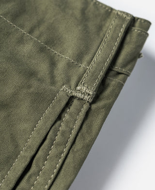 Olive pant hem with adjustable drawcord and stitched pleat detail