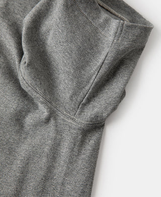 Gray heather t-shirt sleeve and side seam detail with stitched panel