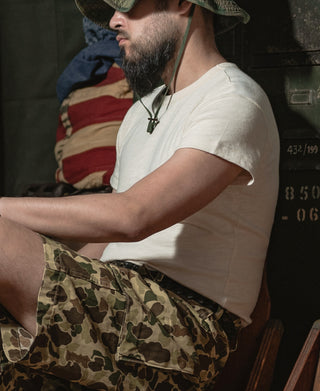 Light apricot crew-neck slub cotton T-shirt worn with camo shorts