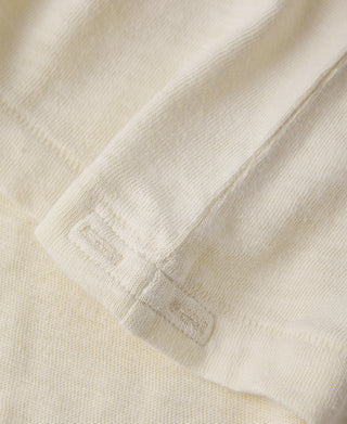 Light apricot slub cotton T-shirt fabric and side seam close-up