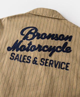 Khaki striped chore coat back text: Bronson Motorcycle Sales & Service