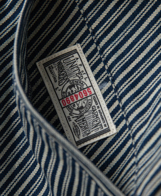 Striped cossack jacket interior brand label near side seam close-up