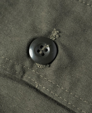 Olive utility shorts close-up of round button with stitched buttonhole