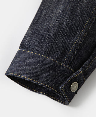 Indigo denim jacket cuff hem with contrast stitching and round metal button
