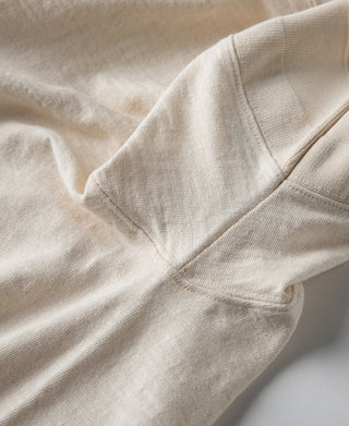Loopwheel henley t-shirt fabric drape with diagonal sleeve seam in apricot-beige