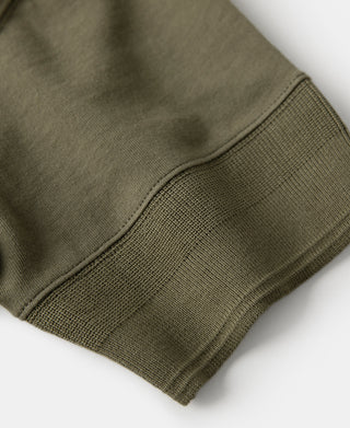 Olive henley t-shirt sleeve cuff stitching close-up