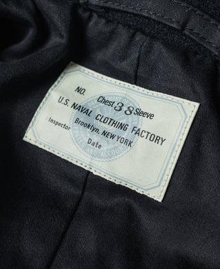 Navy peacoat fabric label inside with size and sleeve info