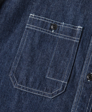 Dark blue denim workshirt chest pocket with stitched square and button