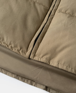 Khaki quilted padded vest hem with stitched trim and side panel seams