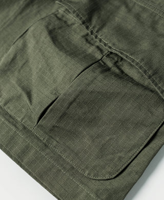 Olive fatigue jacket chest pocket with flap and angled opening