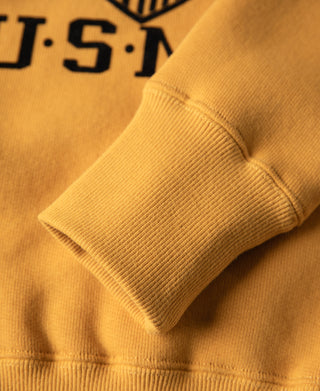 Yellow raglan sweatshirt cuff and sleeve seam close-up