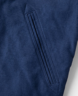 Blue jacket sleeve with stitched panel detail near cuff