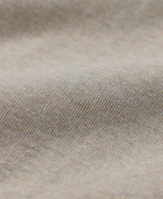 Close-up of light heather beige knit fabric surface texture