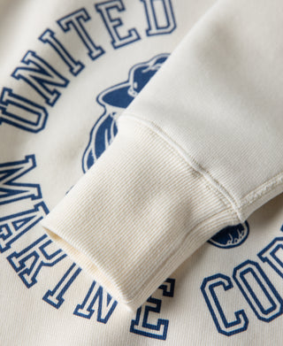 White raglan sweatshirt sleeve and blue "UNITED" lettering with logo