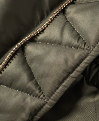 Olive N-3 parka quilted interior panel with reinforced seam stitching.