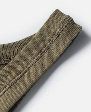 Olive tank top sleeve edge with ribbed collar seam and visible stitching