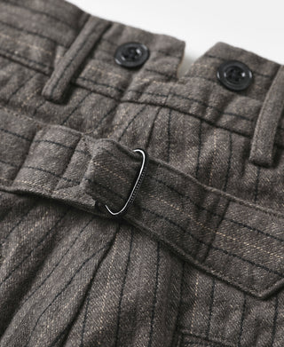Dark gray pinstripe pants with adjustable strap detail and front pocket flap