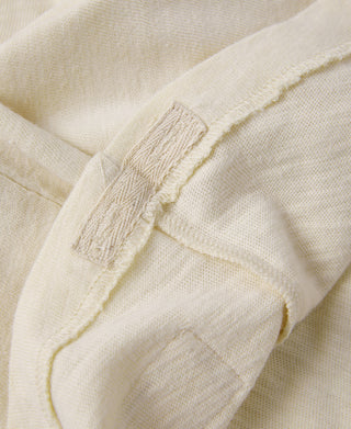 Light apricot slub cotton T-shirt sleeve hem with stitched cuff detail
