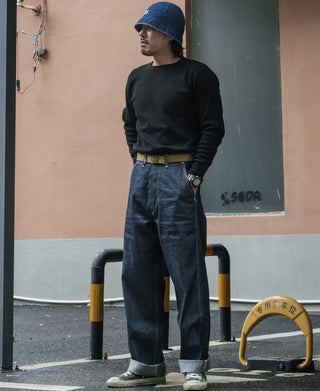 Black waffle-knit long-sleeve crewneck cotton top on a standing model