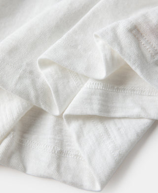 White cotton t-shirt hem and stitching close-up