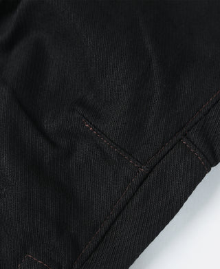 Black riding breeches seam detail with diagonal stitched panel