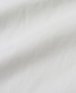 White textured henley fabric close-up with fine knit grain